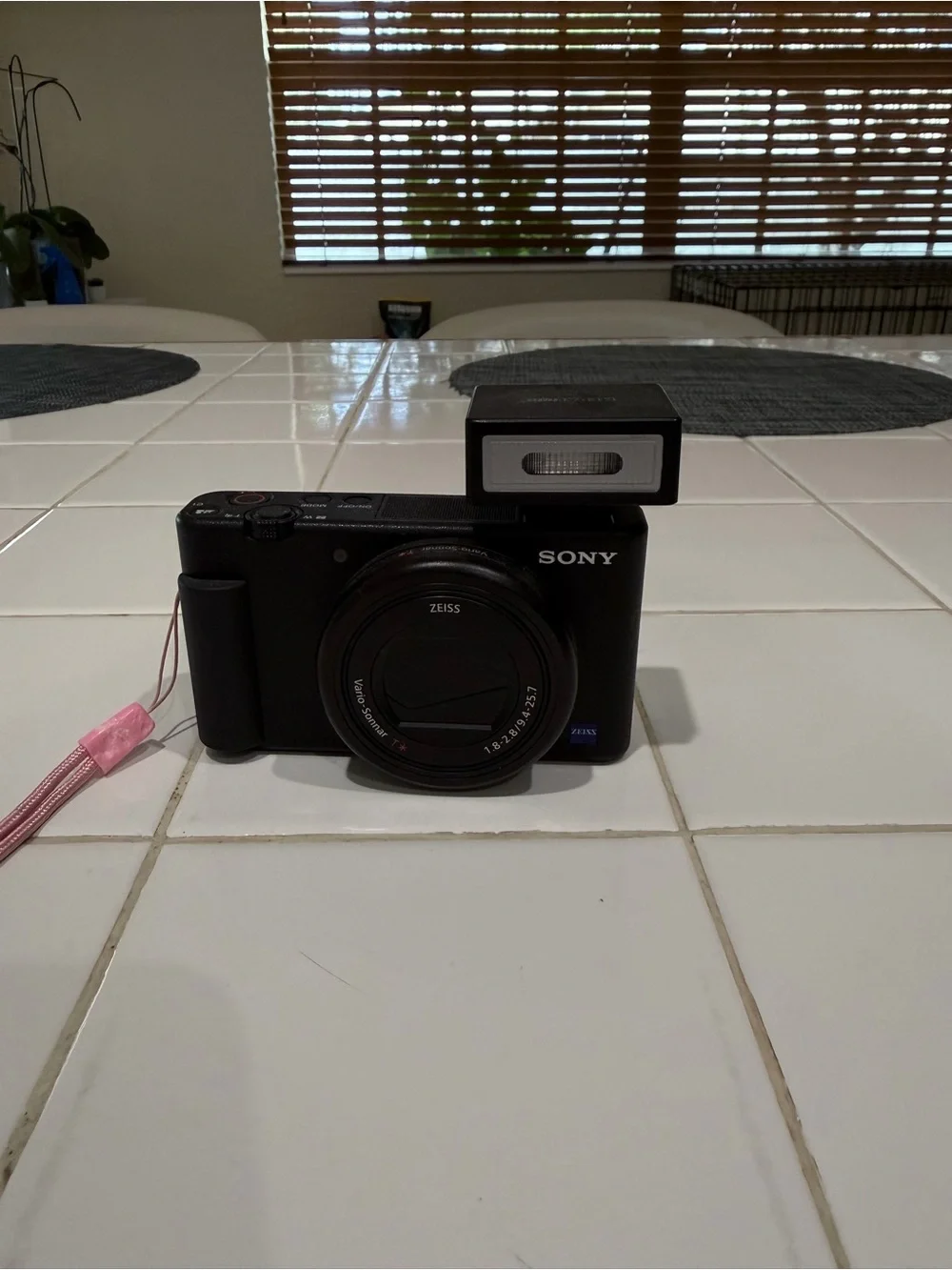 Sony Black Compact Digital Camera with Detachable Flash and Pink Strap